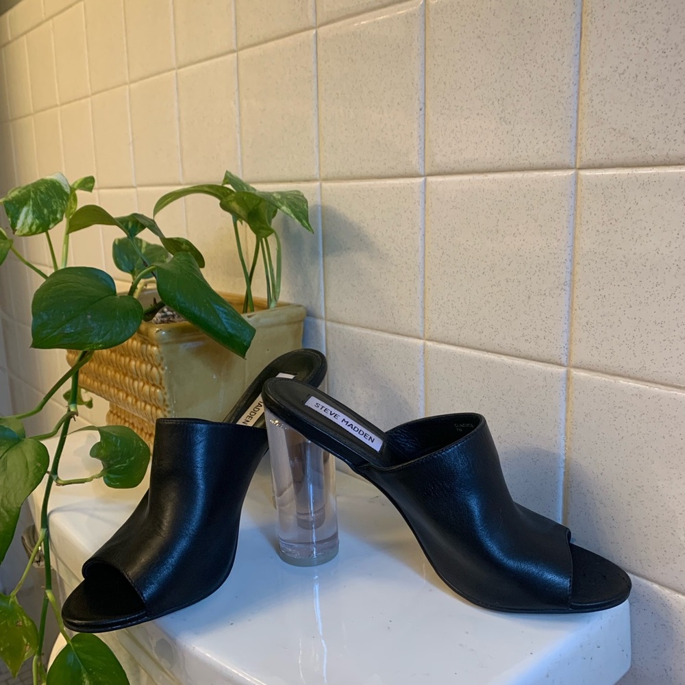 Leather Steven Madden shoes with clear heel.